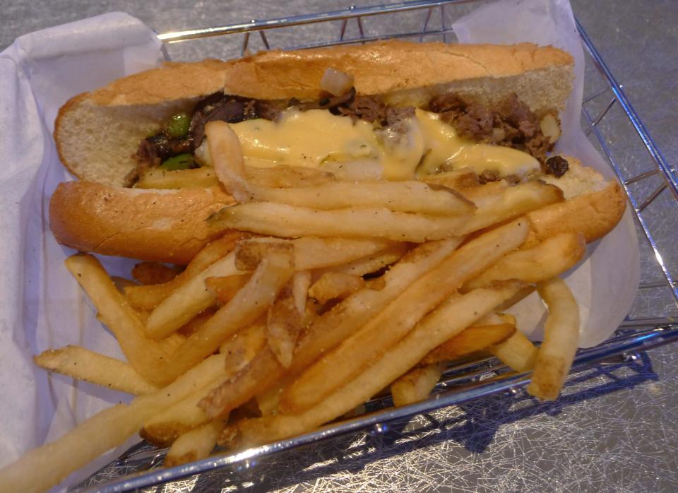 A Philly cheesesteak is on the menu at Dave & Buster's outside Jordan Creek Town Center in West Des Moines.