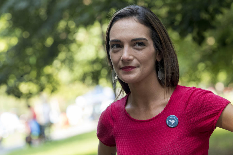 FILE - In this Aug. 15, 2018, file photo, Democratic New York state Senate candidate Julia Salazar smiles as she speaks to a supporter before a rally in McCarren Park in the Brooklyn borough of New York. Salazar is taking on 16-year-incumbent Sen. Martin Dilan in Brooklyn's 18th District. (AP Photo/Mary Altaffer, File)