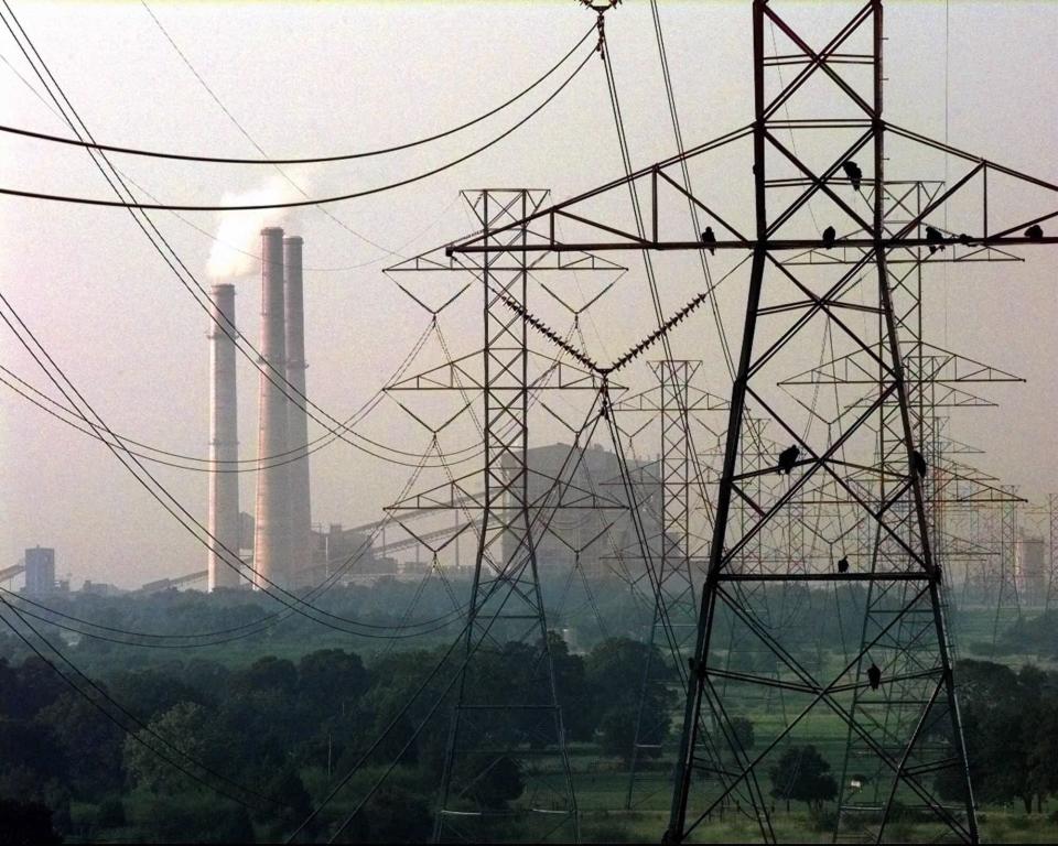 The Fayette Power Project seen in the distance is a coal fired, electric generating power plant co-owned by the City of Austin and the Lower Colorado River Authority. Proposition on the Nov. 7 ballot would create a $5 billion state energy fund to provide loans or grants to companies to build or upgrade electricity generating plants. (Credit: American-Statesman/File)