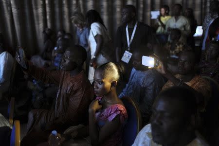 Guests watch the Festi'Bazin runway show in Bamako, Mali, October 16, 2015. REUTERS/Joe Penney