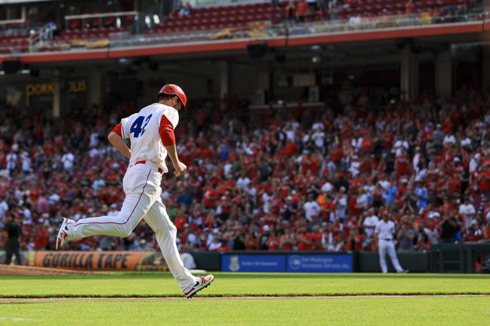 Cincinnati Reds' Wil Myers runs the bases after hitting a three-run home run during the third inning of a baseball game against the Philadelphia Phillies in Cincinnati, Saturday, April 15, 2023. (AP Photo/Aaron Doster)