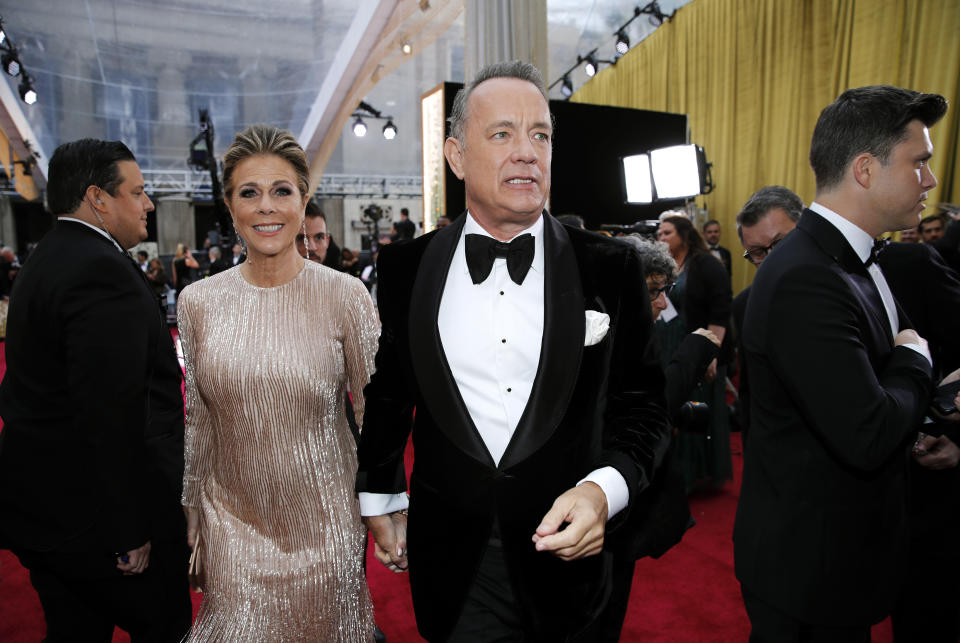 Tom Hanks and Rita Wilson walk on the red carpet during the Oscars arrivals at the 92nd Academy Awards in Hollywood, Los Angeles, California, U.S., February 9, 2020. REUTERS/Mike Blake