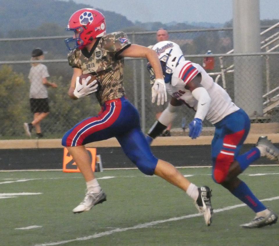 Licking Valley senior Ayden Stalnaker runs after a catch downfield with Lakewood junior Isaiah Mitchell in pursuit on Friday, Sept. 16, 2022 at Randy Baughman Stadium. The Panthers shut out the visiting Lancers 41-0.