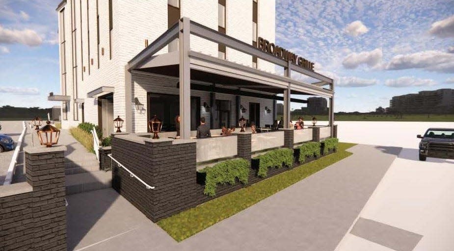 This is a computer graphic of a proposed restaurant on the ground floor of a building at 3400 N. High St. in Clintonville. Steve Hutchinson, owner of the professional building, is seeking variances to allow for the construction of a first‐floor restaurant and exterior patio in the existing 4‐story office structure.