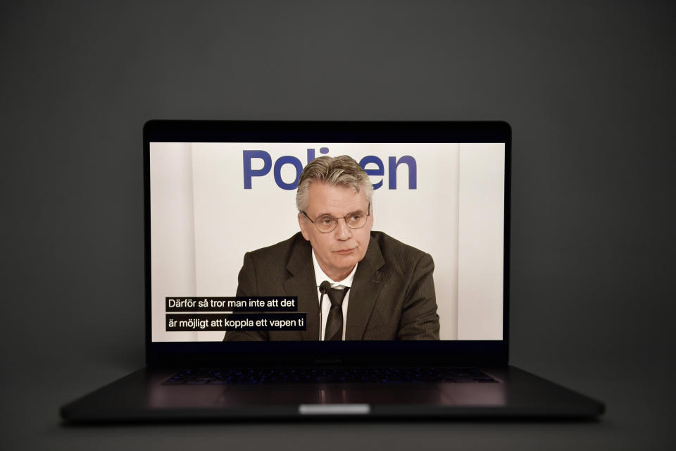 Reconnaissance leader Hans Melander is seen on a laptop screen as he gives a press conference on the case of Swedish Prime Minister Olof Palme who was shot dead in February 1986, in Stockholm, Sweden, Wednesday, June 10, 2020. Sweden on Wednesday dropped its investigation into the unsolved murder of former Swedish Prime Minister Olof Palme, who was shot dead 34 years ago in downtown Stockholm because the main suspect, Stig Engstrom, had died in 2000. Writing on screen reads in Swedish "..therefore, it is not believed that it is possible to attach a weapon..." (Fredrik Sandberg/TT via AP)