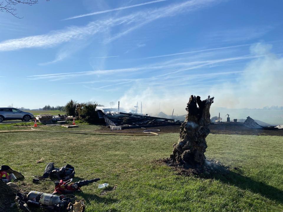 This is all that was left of a barn at 4165 Funk Road, Shelby in this file photo. Shelby firefighters fought the blaze with mutual aid from Crestline, Springfield Township and Tiro fire departments. The residents lost tools and recreational equipment. Even this tree was still smoking due to dry conditions and strong winds.