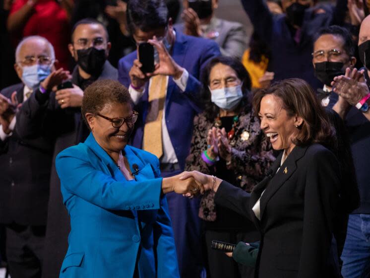 LOS ANGELES, CA - DECEMBER 11: Los Angeles Mayor Karen Bass shakes hands with Vice President Kamala Harris following the oath of office during inauguration ceremonies at Microsoft Theater on Sunday, Dec. 11, 2022 in Los Angeles, CA. (Myung J. Chun / Los Angeles Times)