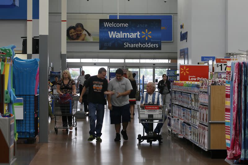 FILE PHOTO: Customers shop at a Walmart Supercenter in Rogers