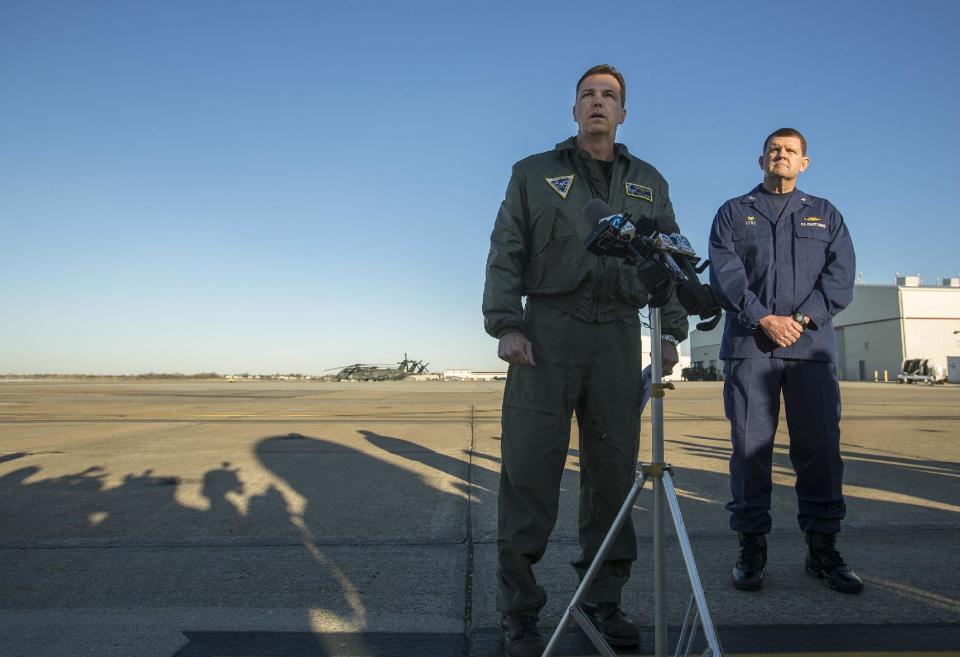 Navy Cmdr. Todd Flannery, left, Cmdr. Helicopter Sea Combat Wing Atlantic, and U.S. Coast Guard Capt. John K. Little, Sector Commander, as they answer questions about a crash of a Navy MH-53-E Sea Dragon helicopter into the Atlantic off Virginia Beach, Wednesday, Jan. 8, 2014, on the tarmac at the Norfolk Naval Station, Va. (AP Photo/The Virginian-Pilot, Bill Tiernan) MAGS OUT.