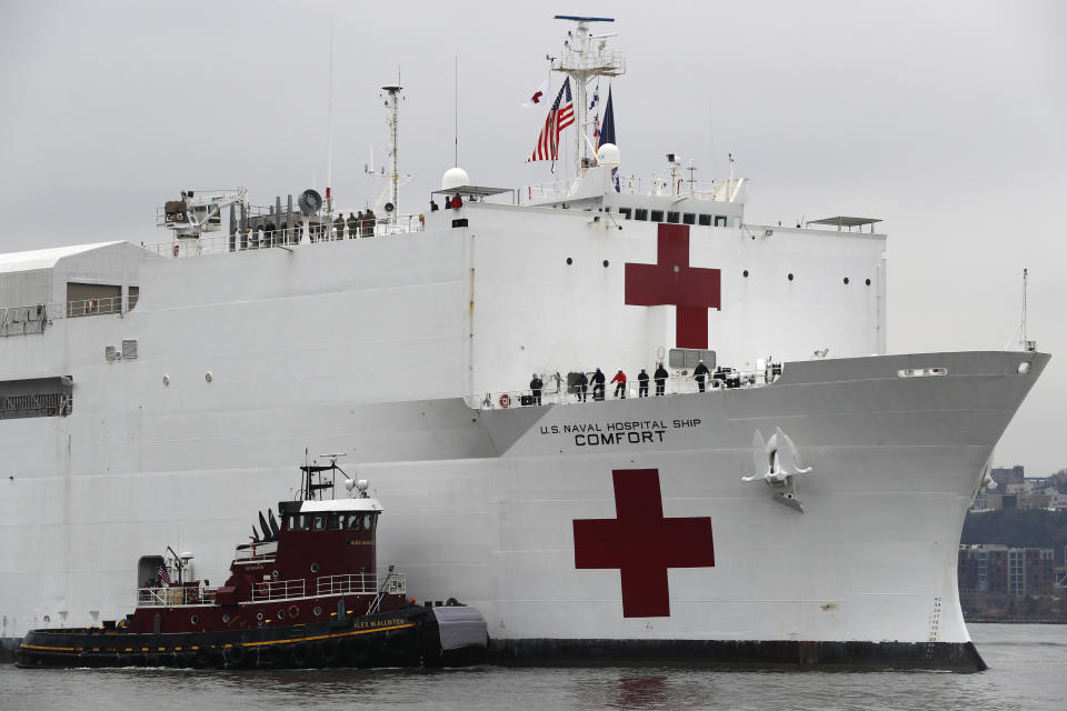 In this March 30, 2020 file photo, the U.S. Navy hospital ship USNS Comfort is escorted up the Hudson River on its way to New York City. On Tuesday, April 21, 2020, while expressing confidence that stresses on New York City's hospital system are easing, New York Gov. Andrew Cuomo said that the ship deployed to New York City to help fight the coronavirus outbreak is no longer needed. (AP Photo/Kathy Willens. File)