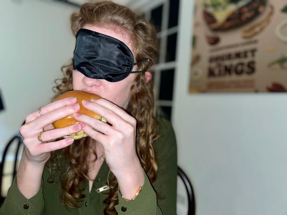 Insider reporter eating Burger King burger