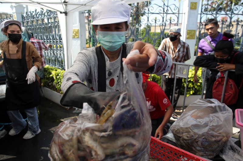 Anti government protesters sell shrimps in front of government house as people now fear to eat shrimps due to the COVID-19 outbreak in Bangkok