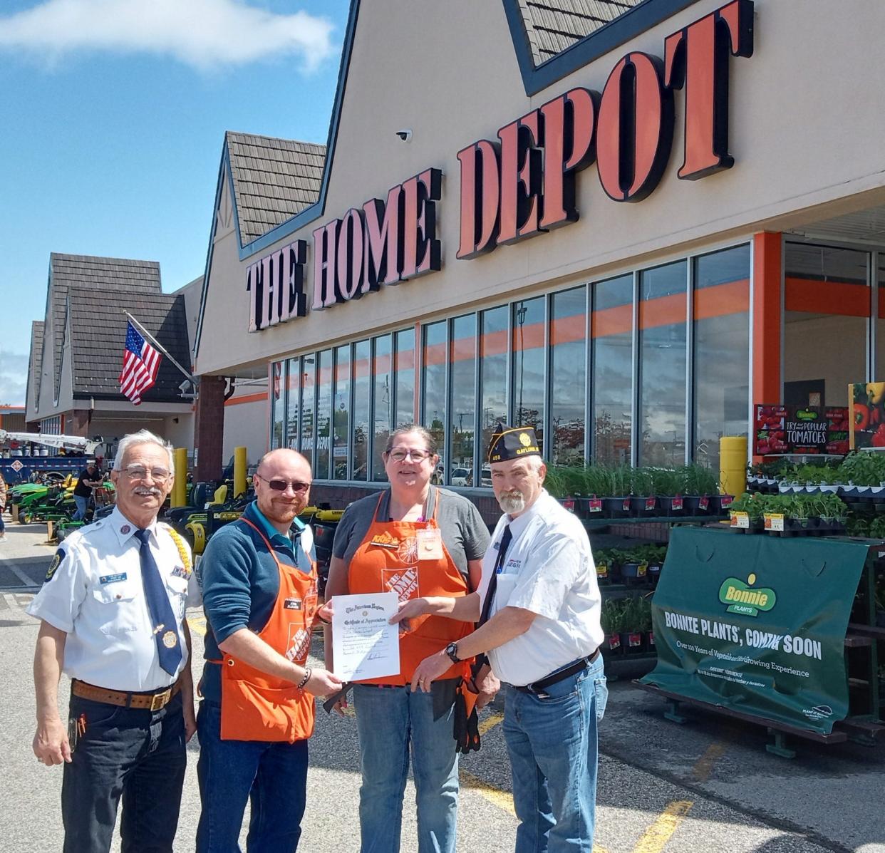 (From left) Tom Serino of Gaylord American Legion Post 458, Rick Adcock, store manager of the Home Depot in Gaylord, Home Depot Specialty Department Supervisor Kris Walsh and Steve Penrose, commander of the post, are presenting Adcock and Walsh with a certificate of appreciation for the store's donations over the last year in support of the post and veterans.