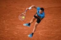 Austria's Dominic Thiem serves the ball to Tommy Paul of the US during their men's singles first round match on day two of The Roland Garros 2019 French Open tennis tournament in Paris on May 27, 2019. (Photo by Anne-Christine Poujoulat/AFP/Getty Images)