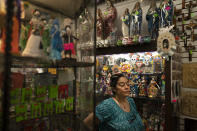 Valerie Hanley, owner of Casa California souvenir shop on Olvera Street and treasurer of the Olvera Street Merchants Association Foundation, stands for a photo in her shop in Los Angeles, Friday, June 4, 2021. Most businesses are no longer open daily and many have cut back to four or five days, said Hanley. "We're not like a local restaurant in your town," Hanley said. "We're one of those little niche things. If you can't fill the niche with the right people, we're in trouble." (AP Photo/Jae C. Hong)