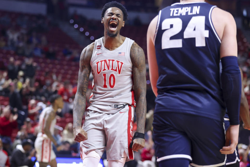 UNLV forward Kalib Boone (10) yells after a dunk against the Utah State during the first half of an NCAA college basketball game Saturday, Jan. 13, 2024, in Las Vegas. (AP Photo/Ian Maule)