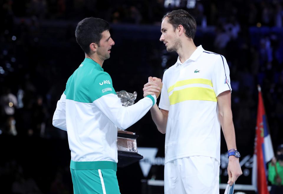 Novak Djokovic (pictured left) greets Daniil Medvedev (pictured right) after their men's singles final at Australian Open in Melbourne Park in Melbourne, Australia, Feb. 21, 2021.