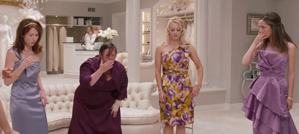 Rita, Megan, Becca, and Helen from "Bridesmaids" feel sick after eating at a restuarant