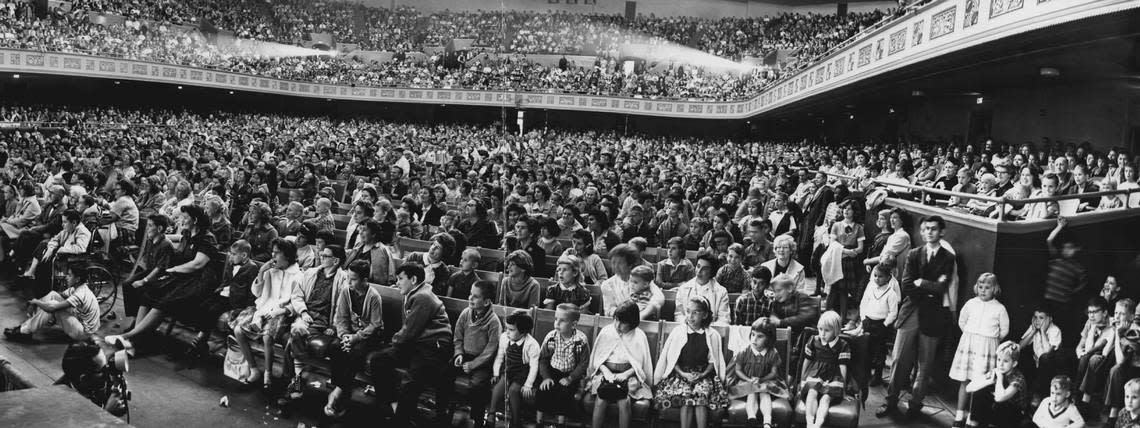 A full house packs the Sacramento Bee’s annual Christmas show, held in conjunction with its radio station KFBK, in 1962. The free event featured Santa Claus and vaudeville acts, including gold miners trying to remember which holiday was celebrated on Dec. 25. Other performers included a family of banjo players, “rolicking stars of dogdom” Leone’s Canines, a belling ringing act, juggling, acrobatics and a baby elephant. Harlin Smith/Sacramento Bee file