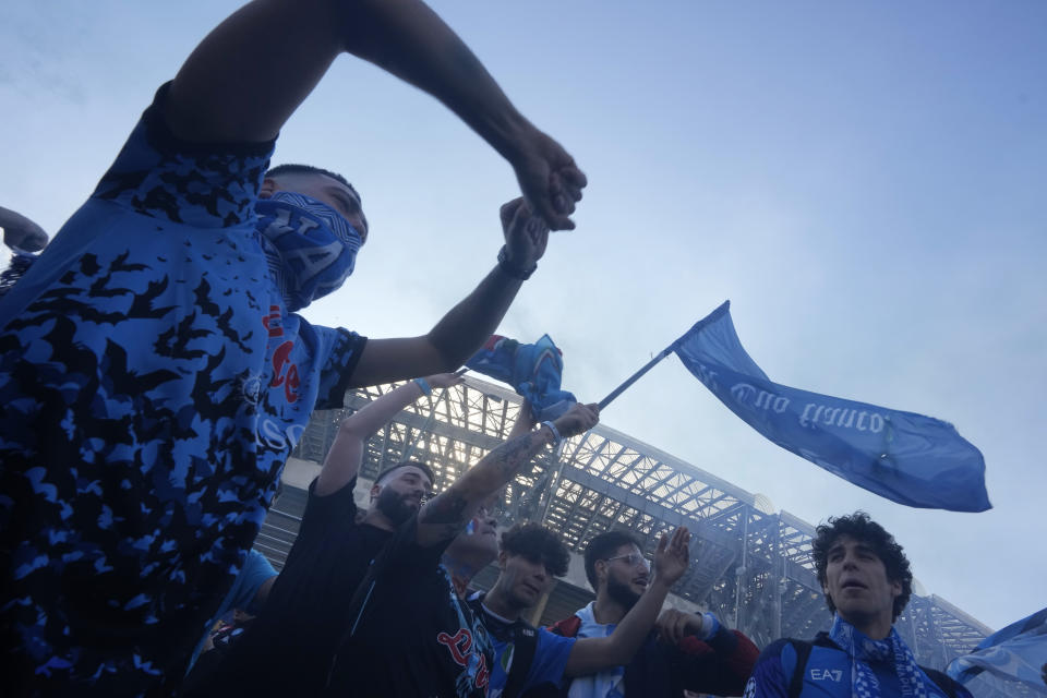 Napoli fans cheer in front of the Diego Armando Maradona stadium, in Naples, Italy, Thursday, May 4, 2023. (AP Photo/Andrew Medichini)