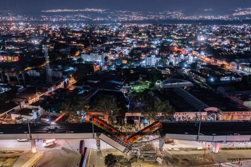 MEXICO CITY, MEXICO - MAY 03: An aerial view of the scene after an elevated section of metro track in Mexico City, carrying train cars with passengers, collapsed onto a busy road on May 03, 2021 in Mexico City, Mexico. The Line 12 accident happened as the metro train was traveling between Olivos and Tezonco Metro stations, reportedly killing at least 20 people and injuring further 70. (Photo by Hector Vivas/Getty Images)