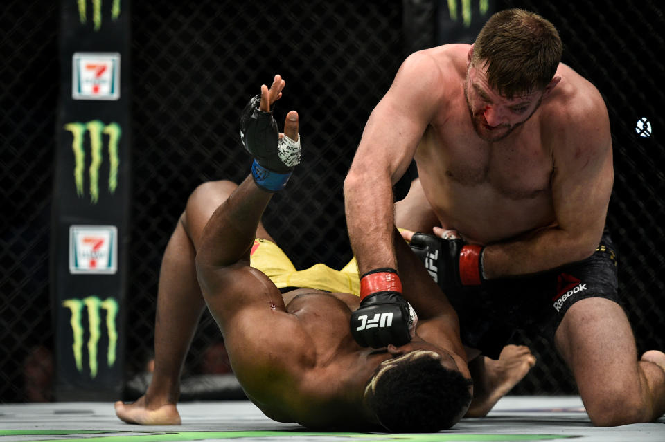 Stipe Miocic lands a right from the top on Francis Ngannou en route to retaining his heavyweight title on Jan. 20 at UFC 220 in Boston. (Getty Images)