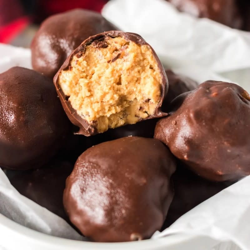 <p>Persnickety Plates</p><p>Little bite-sized Rice Krispie treats.</p><p><strong>Get the recipe: <a href="https://www.persnicketyplates.com/chocolate-rice-krispie-peanut-butter-balls-no-bake/" rel="nofollow noopener" target="_blank" data-ylk="slk:Chocolate-Covered Rice Krispie Peanut Butter Balls;elm:context_link;itc:0;sec:content-canvas" class="link ">Chocolate-Covered Rice Krispie Peanut Butter Balls</a></strong></p>