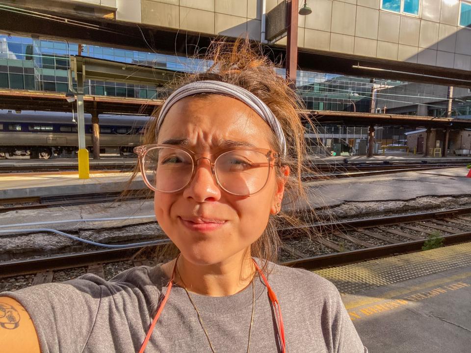 The author is seen outside the train on a platform