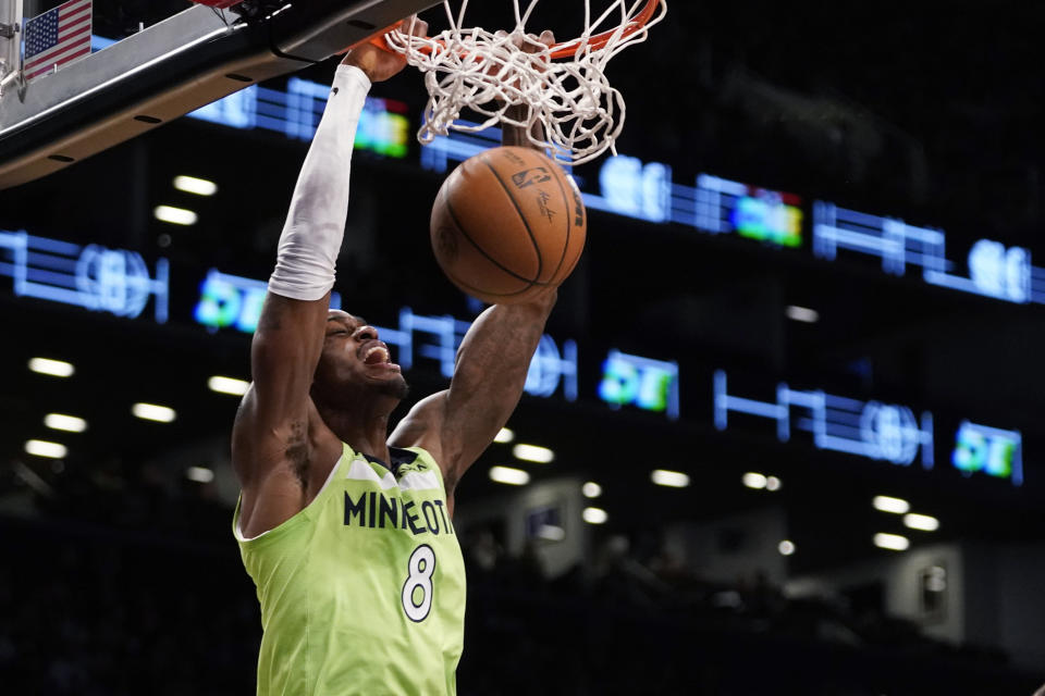 Minnesota Timberwolves forward Jarred Vanderbilt dunks during the first half of the team's NBA basketball game against the Brooklyn Nets, Friday, Dec. 3, 2021, in New York. (AP Photo/Mary Altaffer)
