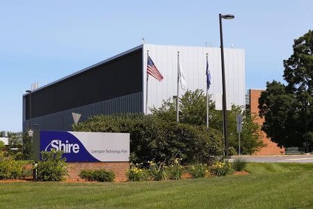 A sign sits in front of Shire's manufacturing facility in Lexington, Massachusetts July 18, 2014. REUTERS/Brian Snyder