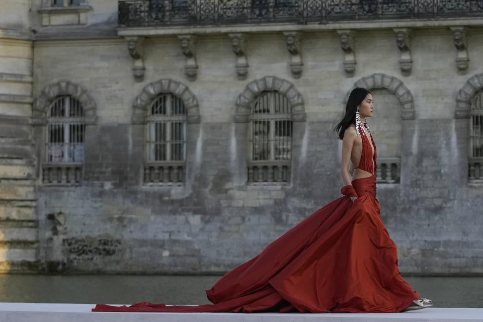 A model wears a creation for the Valentino Haute Couture Fall/winter 2023-2024 fashion collection presented in Chantilly, north of Paris, Wednesday, July 5, 2023. (AP Photo/Christophe Ena)