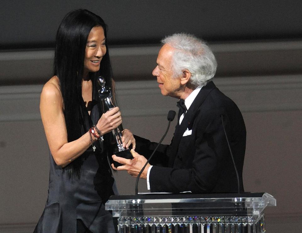 Designer Vera Wang, left, is presented with an award by fellow designer Ralph Lauren at the 2013 CFDA Fashion Awards at Alice Tully Hall on Monday, June 3, 2013 in New York. (Photo by Brad Barket/Invision/AP)