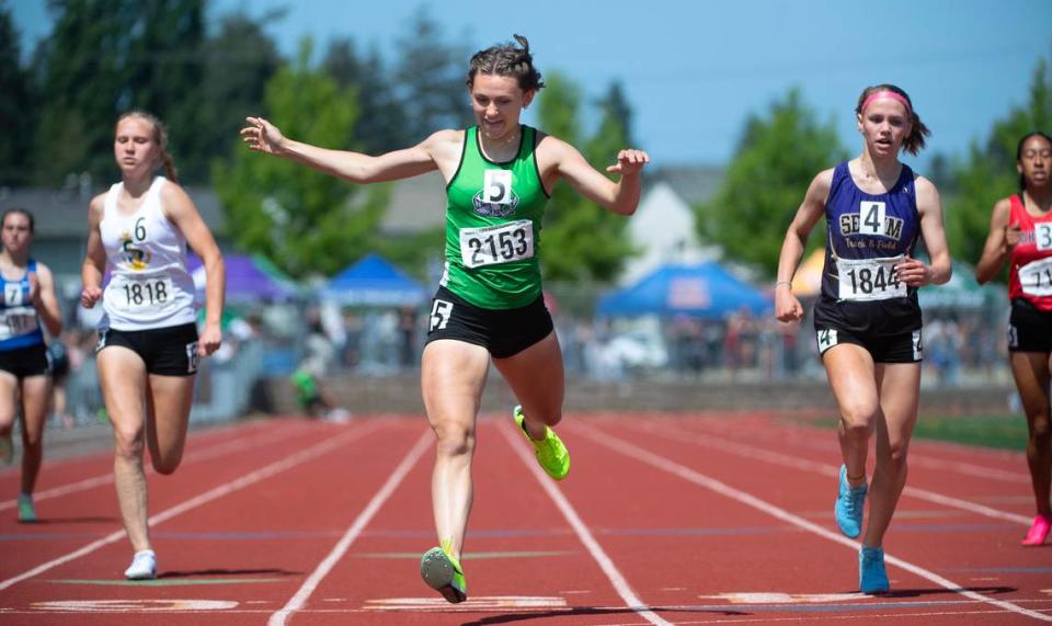 Tumwater’s Annabelle Clapp runs to a state title in the 2A girls 400 meters during the final day of the WIAA state track and field championships at Mount Tahoma High School in Tacoma, Washington, on Friday, May 26, 2023.