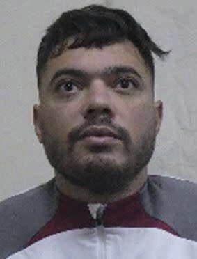 This picture provided by Interpol shows Mohamed Amra, a convict that escaped from prison on Tuesday. May 14, 2024. A massive manhunt is underway in France on Wednesday, May 15, 2024, for an armed gang that ambushed a prison convoy, killing two prison officers, seriously injuring three others and springing the inmate they were escorting. (Interpol via AP)