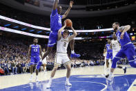 Villanova's Collin Gillespie (2) is fouled by Seton Hall's Romaro Gill (35) during the first half of an NCAA college basketball game, Saturday, Feb. 8, 2020, in Philadelphia. (AP Photo/Matt Slocum)