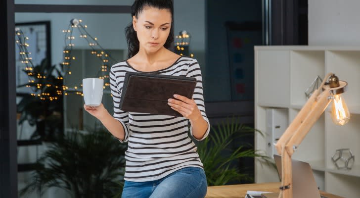 A woman looking at investment choices to see what income investments look best