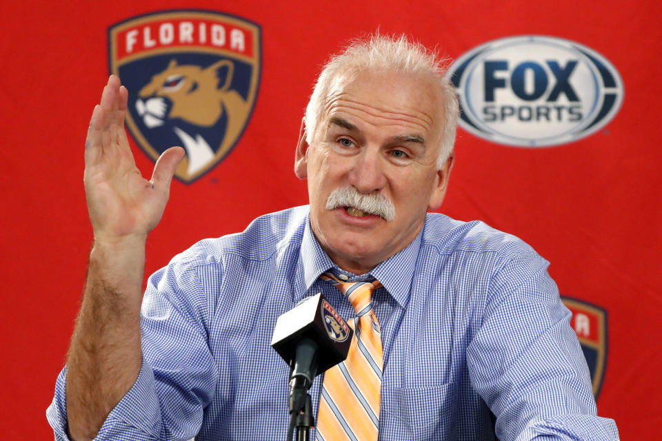 FILE - In this Jan. 21, 2020, file photo, Florida Panthers head coach and former Chicago Blackhawks coach, Joel Quenneville, responds to a question during his first visit back to Chicago as a head coach before an NHL hockey game between the Blackhawks and Panthers. The Blackhawks are holding a briefing Tuesday, Oct. 26, 2021, to discuss the findings of an investigation into allegations that an assistant coach sexually assaulted a player in 2010. The Blackhawks pledged to release the findings of the investigation, which general manager Stan Bowman, former coach Quenneville and others who were in the organization at the time agreed to cooperate with. (AP Photo/Charles Rex Arbogast, File)