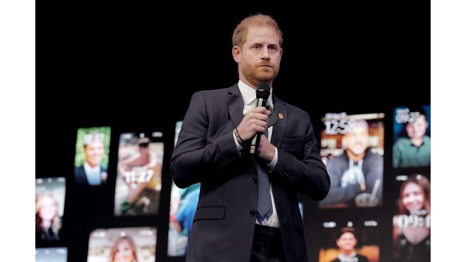 Prince Harry speaking on stage in New York