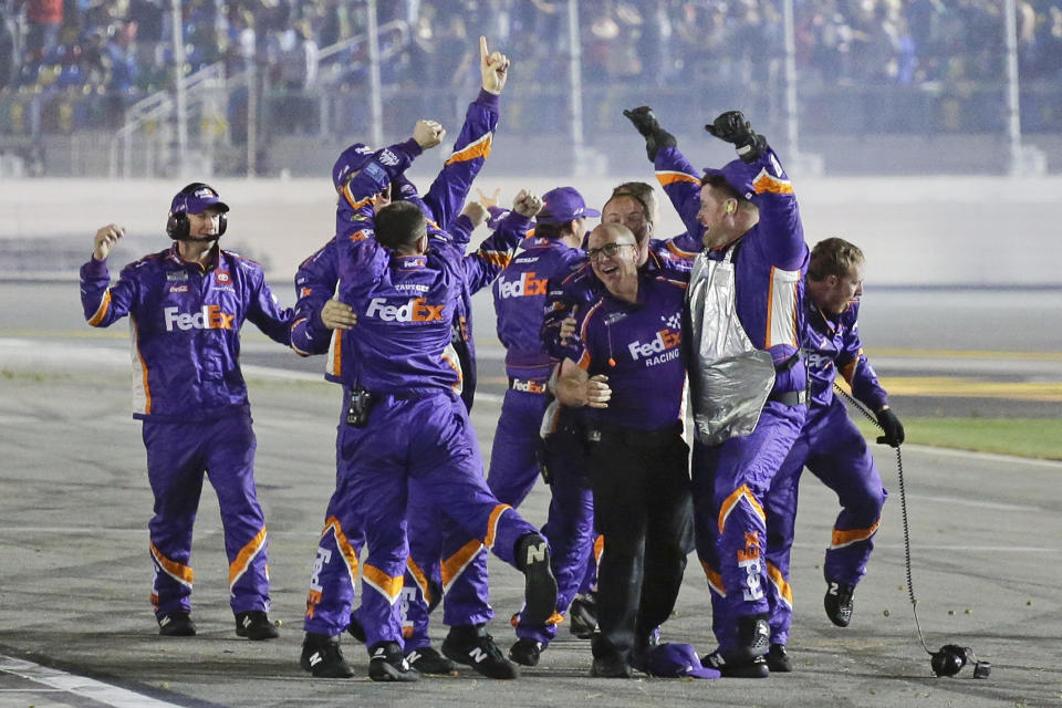 Denny Hamlin's crew celebrates after Hamlin won the NASCAR Daytona 500 auto race at Daytona International Speedway, Monday, Feb. 17, 2020, in Daytona Beach, Fla. (AP Photo/Terry Renna)