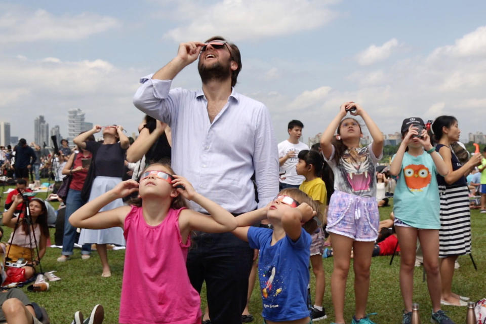 A family watches the eclipse