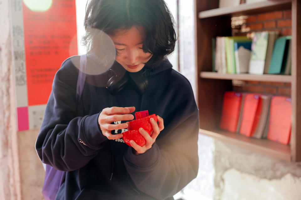 A shopper at Herbeast's pop-up at the multibrand beauty boutique Harmay in Shanghai.