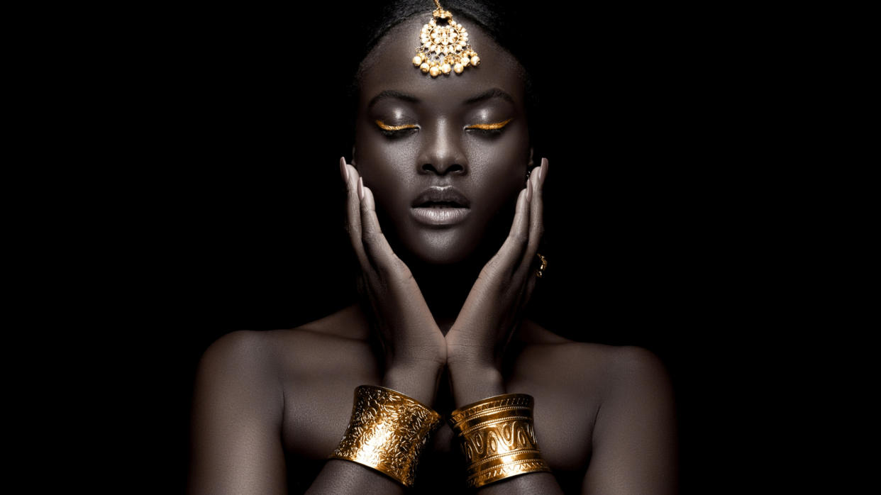  Portrait of an Afro-American woman wearing gold bangles 