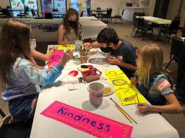Kids work on crafts at St. Gregory the Great Episcopal Church VBS 2022. Photo courtesy of Doug Adkins.