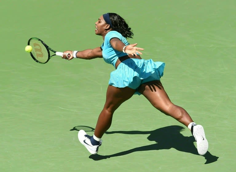 Serena Williams returns the ball to Victoria Azarenka in the women's final of the BNP Paribas Open at the Indian Wells Tennis Garden on March 20, 2016