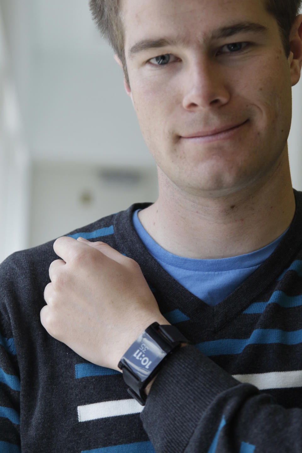 In this April 27, 2012 photo, Pebble Technology founder Eric Migicovsky poses for a portrait wearing the Pebble watch, in New York. In April, three-person startup Pebble Technology sought to raise $100,000 to make the programmable wristwatch. Donors on Kickstarter showered them with more than a hundred times that amount: $10.3 million. Kickstarter is at the center of a new phenomenon known as “crowdfunding” in which donors contribute small portions of money to get a project off the ground. (AP Photo/Mary Altaffer)