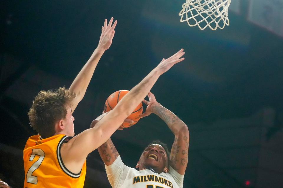 Milwaukee Panthers guard BJ Freeman (10) lays the ball up as Northern Kentucky Norse guard Sam Vinson (2) plays defense during the second half of their game Thursday, Jan. 12, 2023, at UW-Milwaukee Panther Arena in Milwaukee. The Milwaukee Panthers defeated the Northern Kentucky Norse 80-75.