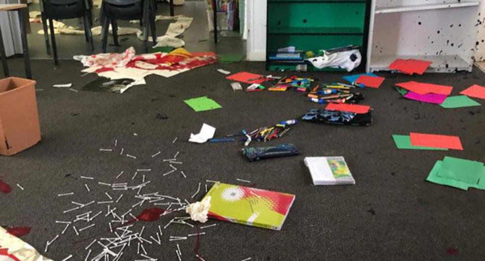 More stationary and books removed from shelves strewn across the carpet. Source: Facebook/ Meridan State College