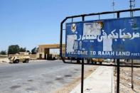 An Egyptian armoured vehicle patrols close to the Rafah border crossing with the Hamas-run Gaza Strip. Egypt's army vowed Monday to "avenge" the killing of 16 troops by gunmen near the Israeli border and President Mohamed Morsi won US backing as he ordered his security forces to take full control of the Sinai