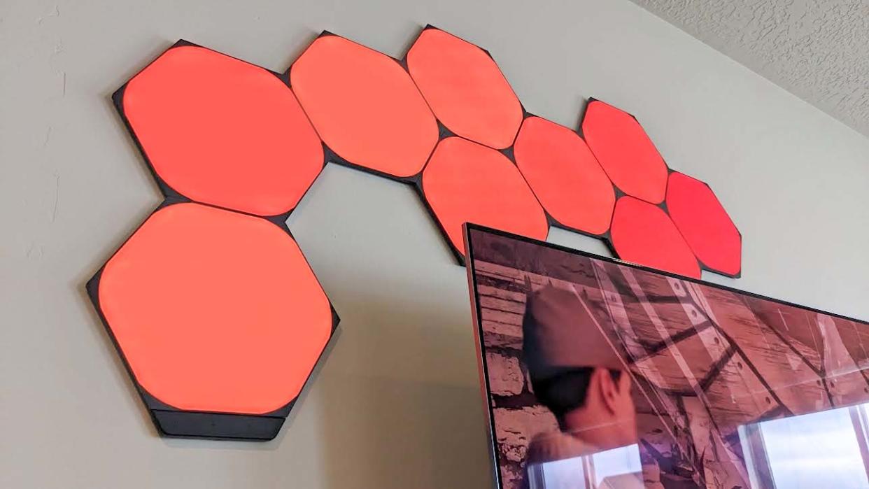  Nanoleaf Shapes Ultra Black Hexagons orange over TV. . 