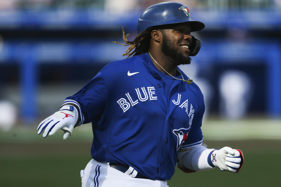 Toronto Blue Jays' Vladimir Guerrero Jr. (27) reaches first base on a single during the seventh inning of a baseball game against the Houston Astros in Buffalo, N.Y., Saturday, June 5, 2021. (AP Photo/Joshua Bessex)